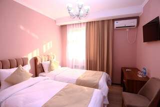Отель Hotel BasTau Zhangaözen Двухместный номер с 2 отдельными кроватями-4
